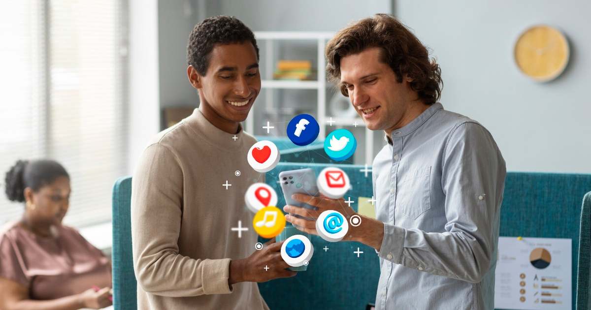 Two men examine a smartphone displaying social media icons, discussing digital marketing trends for 2025.